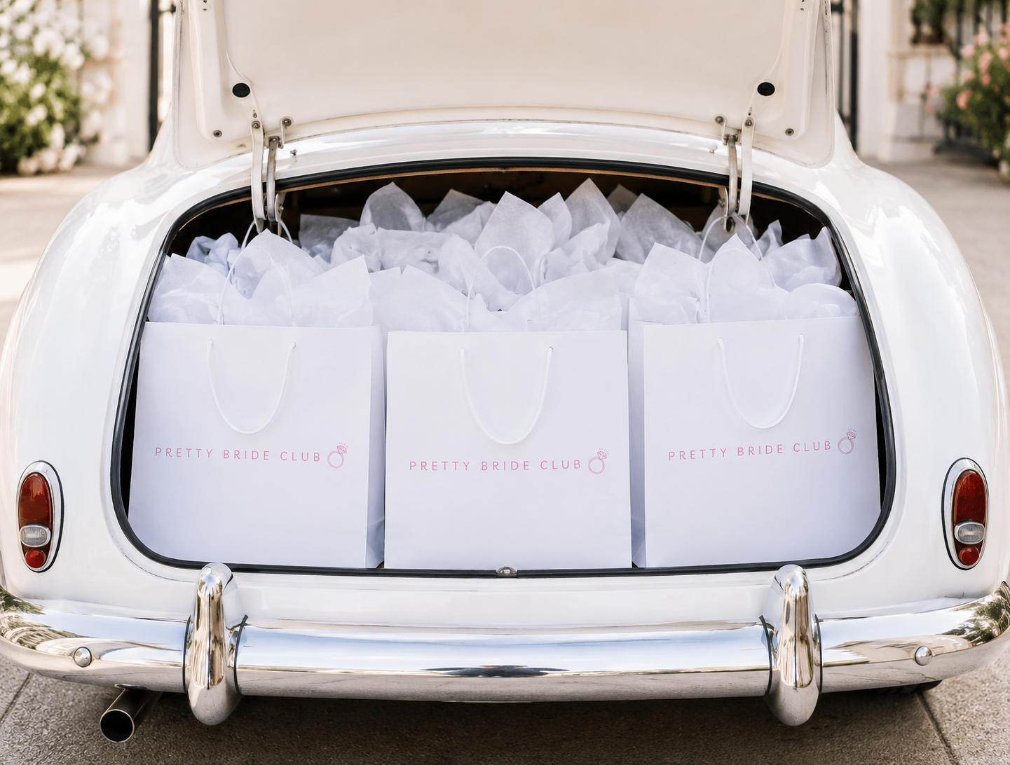 Luxury bridal event flatlay with peonies and rose champagne